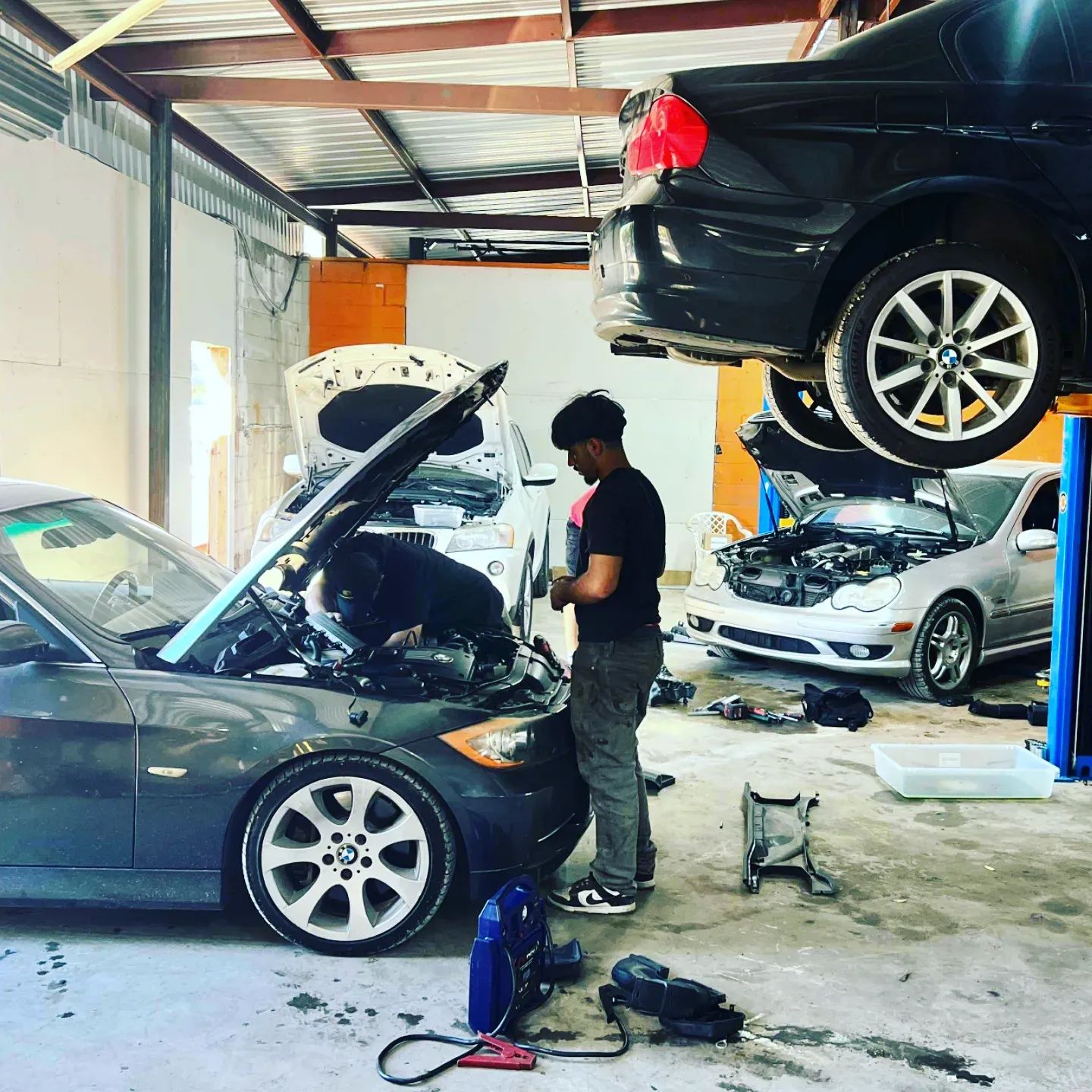 Expert technicians working on vehicle maintenance